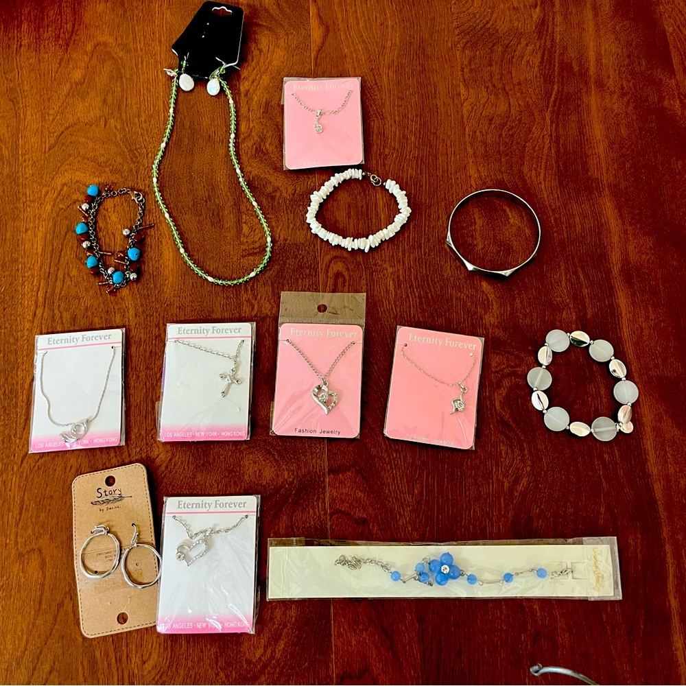 This lot of jewelry includes new in package items.